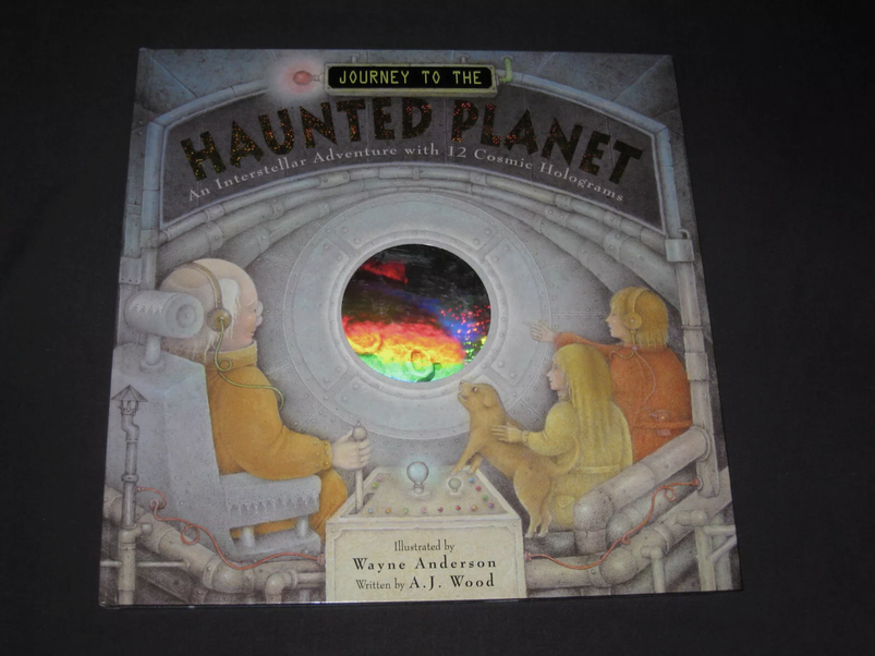 Cover of "Journey to the Haunted Planet" showing the circular inset hologram