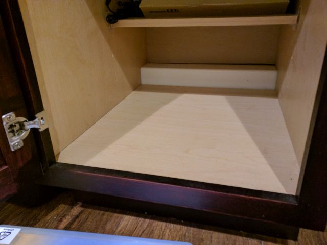 Inside cabinet showing ledge