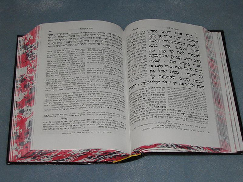 Chumash with red splotches on the edges of the pages