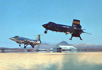 An X-15, with landing skids and nose wheel down, alongside an F-104 with wheels down