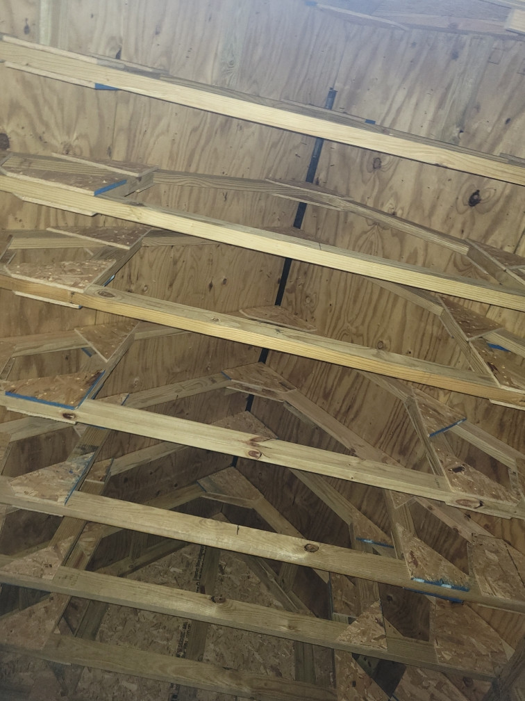 view looking up at roof trusses