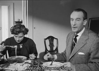 Man and woman eating, captioned, "We can't stay very long"