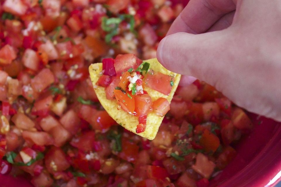 Photo of a chip with Pico de Gallo salsa on it