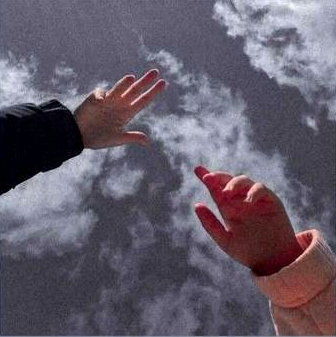 A picture of hands against the sky