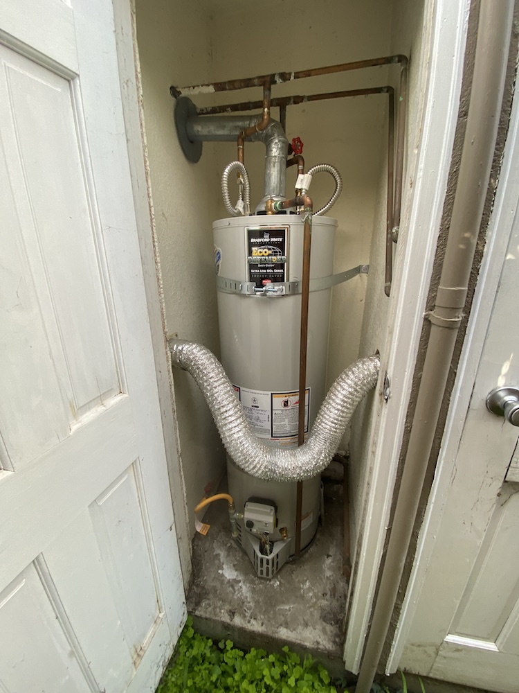 Outdoor utility closet with gas water heater