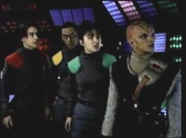 Image showing Ace, Max, Sharkey, and Kulai, a white male, a white female, a dark-skinned male, and an alien female