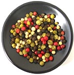 shallow dish of mixed peppercorns