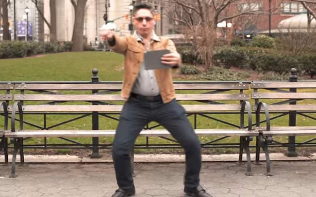 A guy in a park, dancing in front of a tablet to log in. Sometimes, pasta is messy.