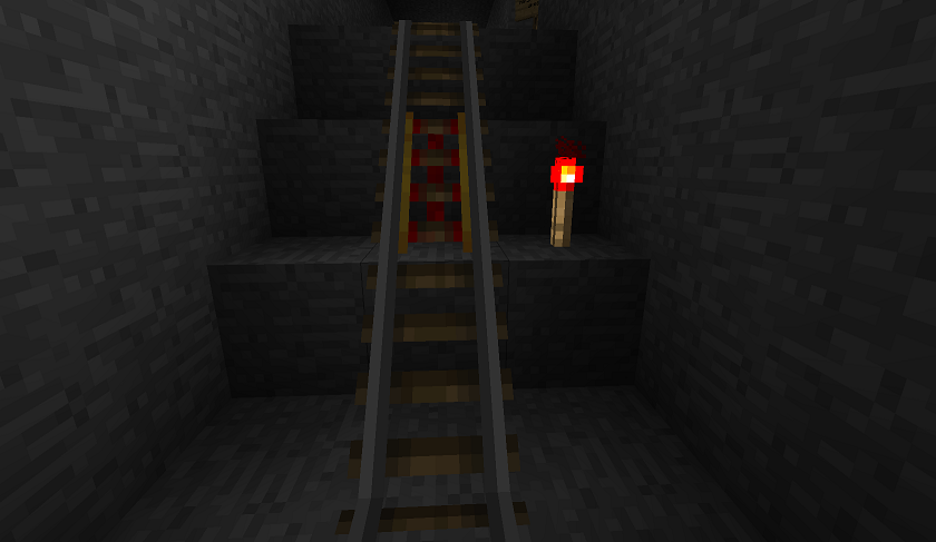 Redstone torch next to powered rail