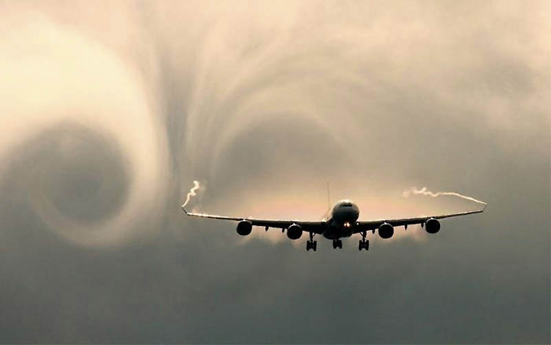 A340 with vortex rollup visible by moisture