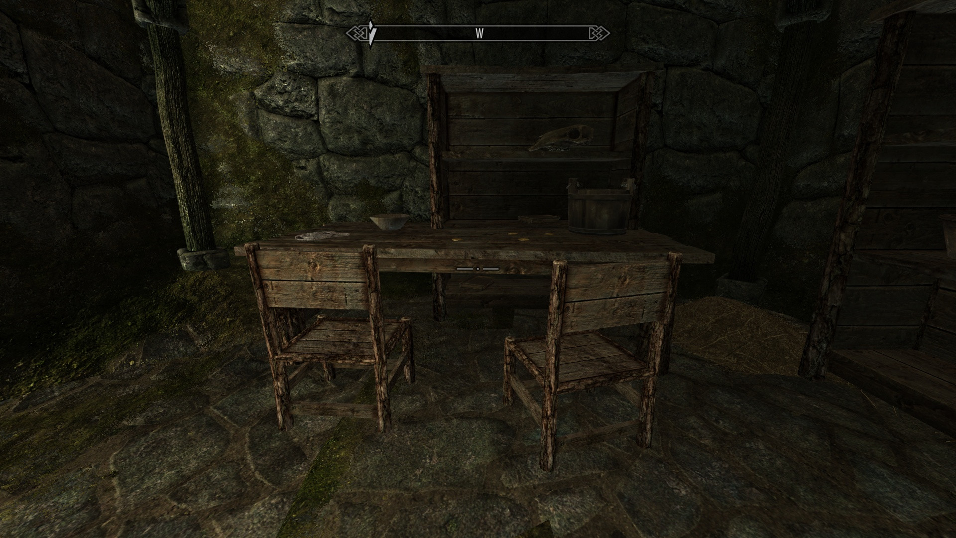 Unreachable book below the crosshair, under table in Helgen