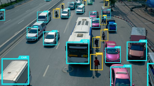 Image of a busy highway, littered with cars, trucks, motorbikes and people which have been labelled with bounding-boxed by the Yolov5 aglorithm. Source: https://deci.ai/blog/how-to-double-yolov5-performance-in-15-minutes