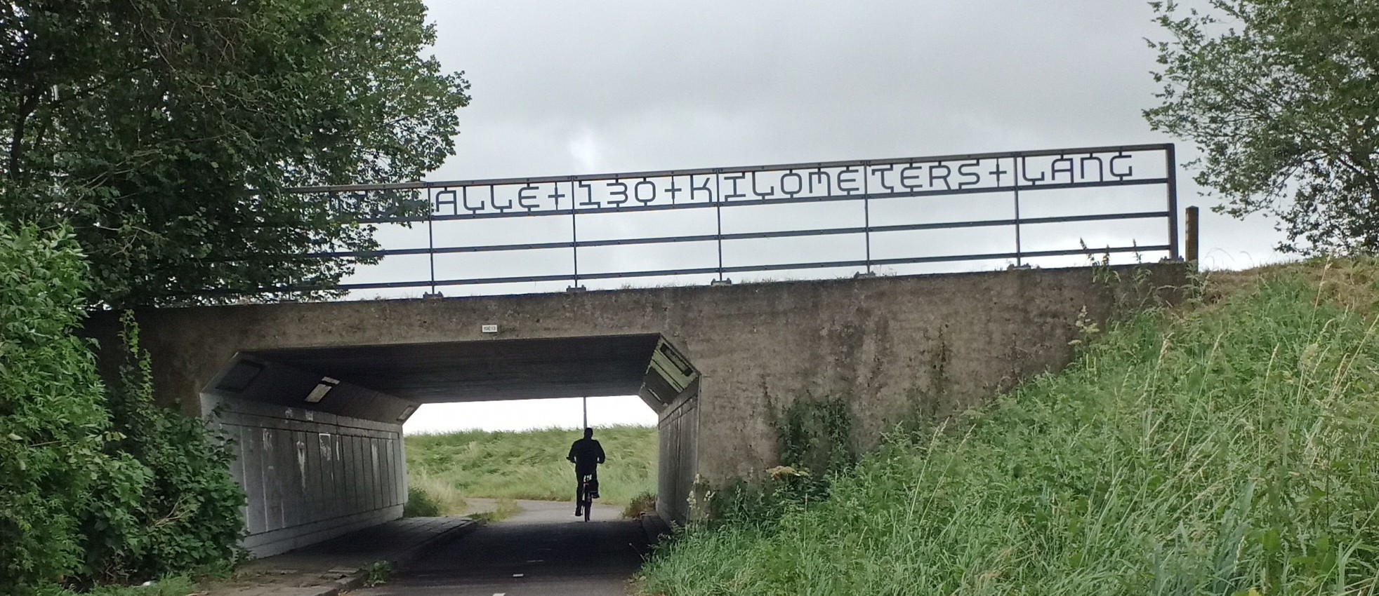 text above a cycling tunnel under the N243 near Averhoorn