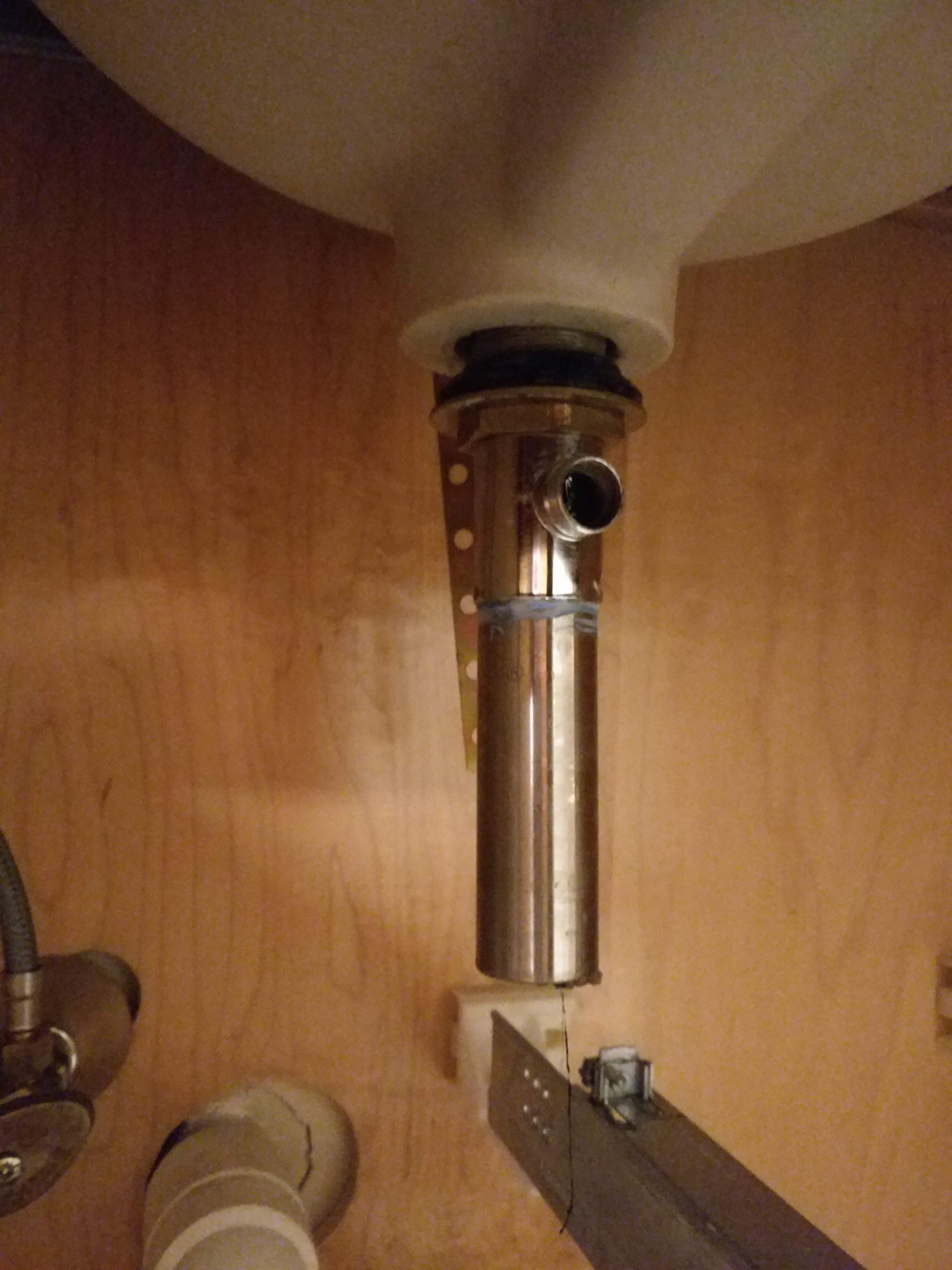 Picture of a drain assembly underneath a sink