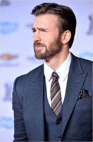 Chris Evans with dark styled hair and a beard