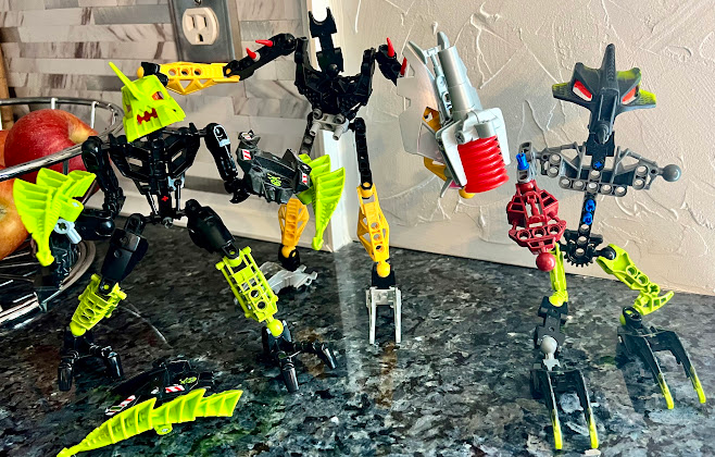 three disassembled bionicles standing up