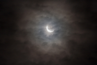 Eclipse through the Clouds