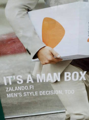 Neatly dressed guy with Zalando box under his arm