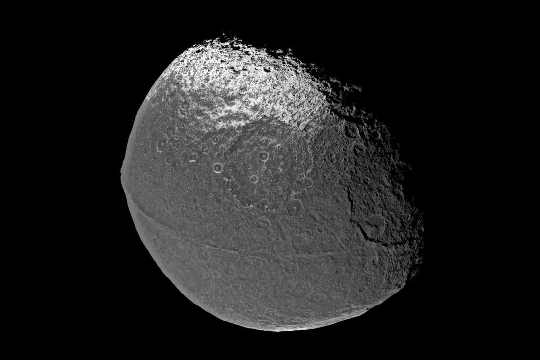 Iapetus, with a ridge of mountains going around its equator