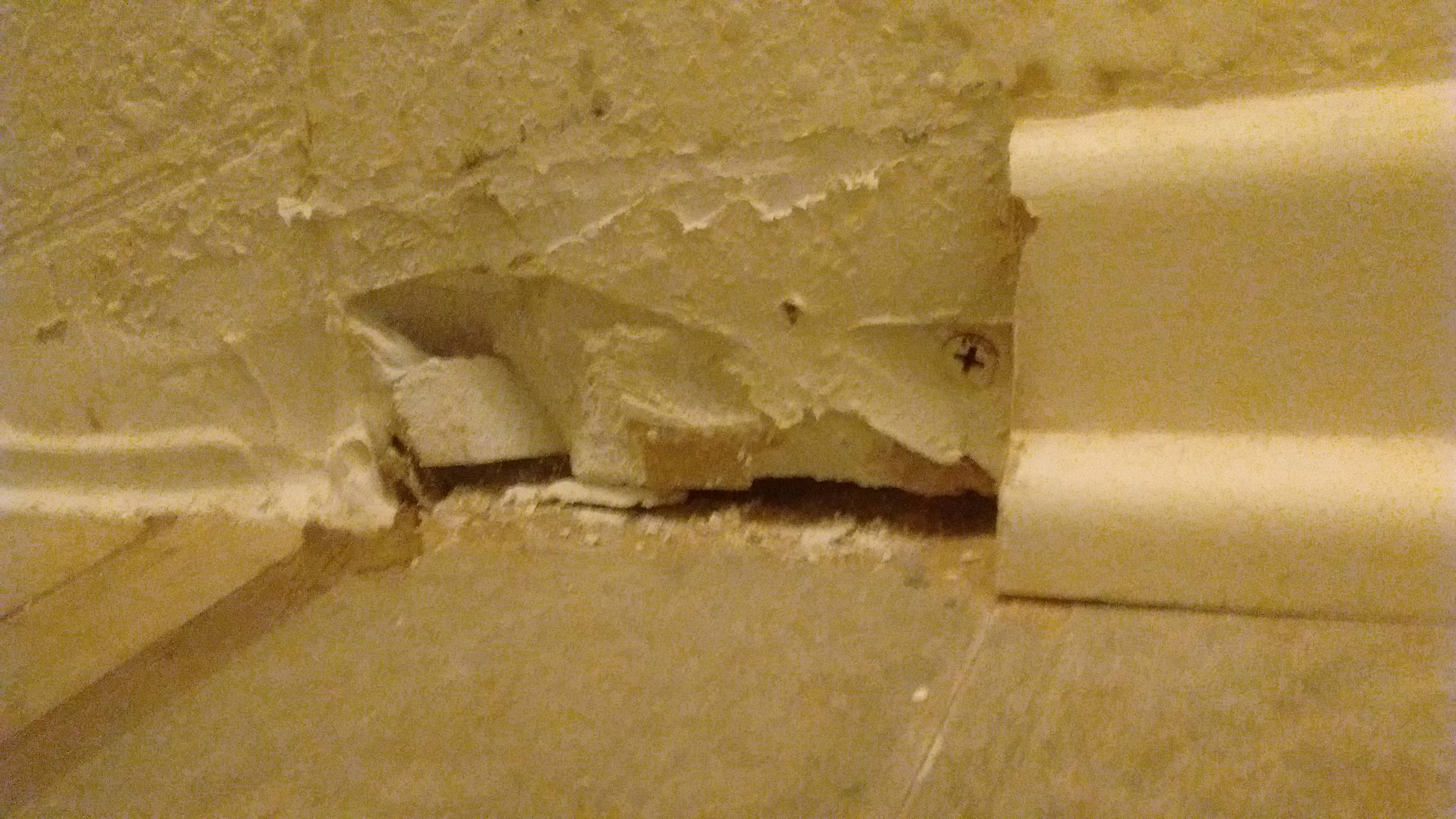 Hole in the base of the drywall