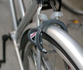 Ring type bike lock (Wikipedia user Hustvedt https://commons.wikimedia.org/wiki/File:Bike_O_Lock_Japan.jpg), CC-BY-SA-3.0