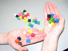 Cubic centimeter cubes in a child's hand