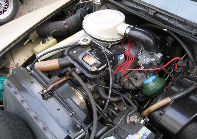 The engine compartment of this 1960s Citröen sedan has the makings of a fireplace, complete with chimney.