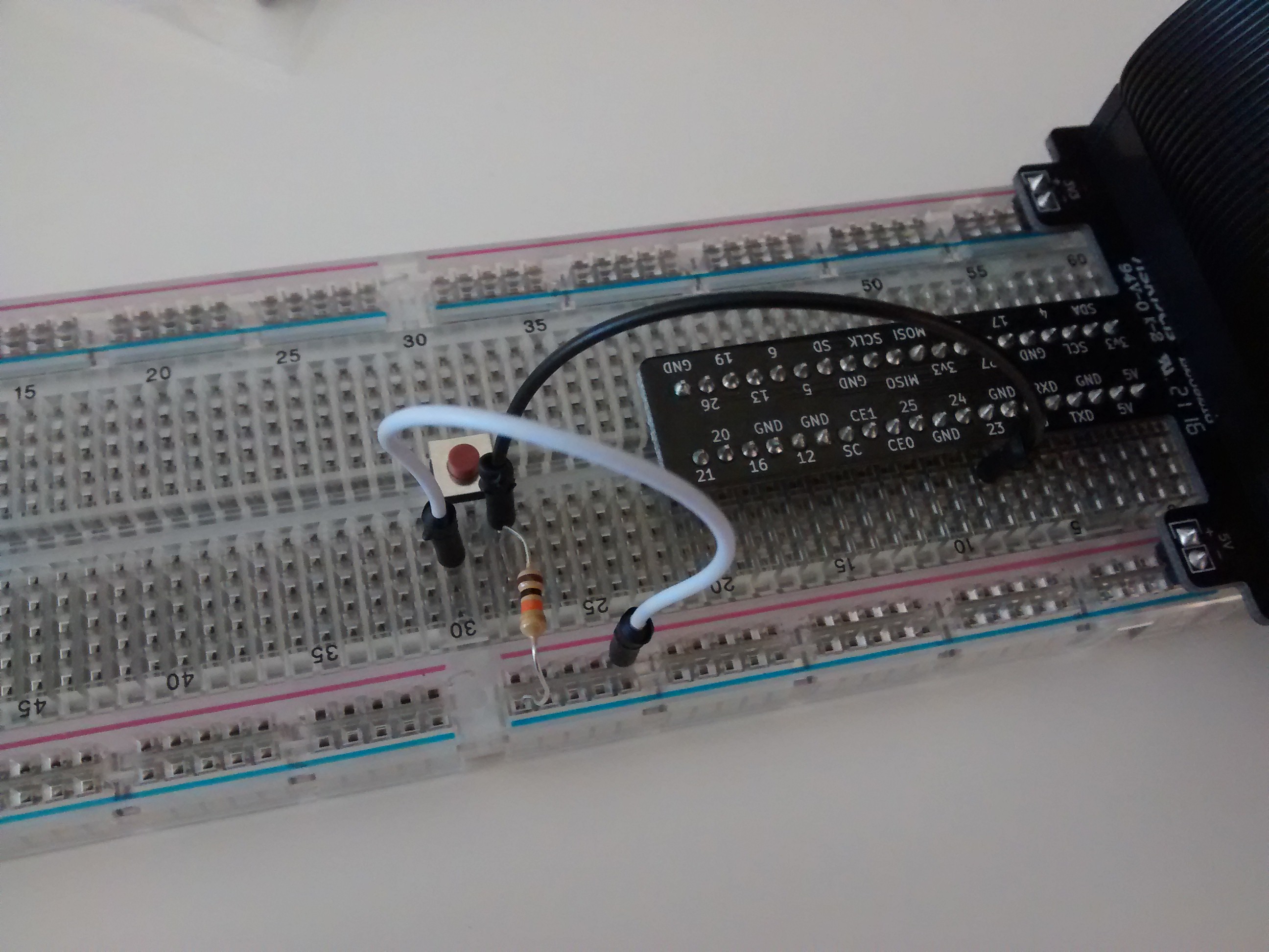 The resistor in the photo is a 10k Ohm 1/4W resistor