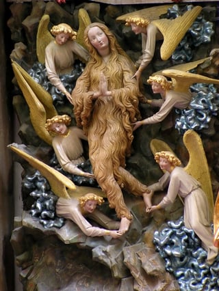 Six angels lift a praying Mary, who is covered in hair