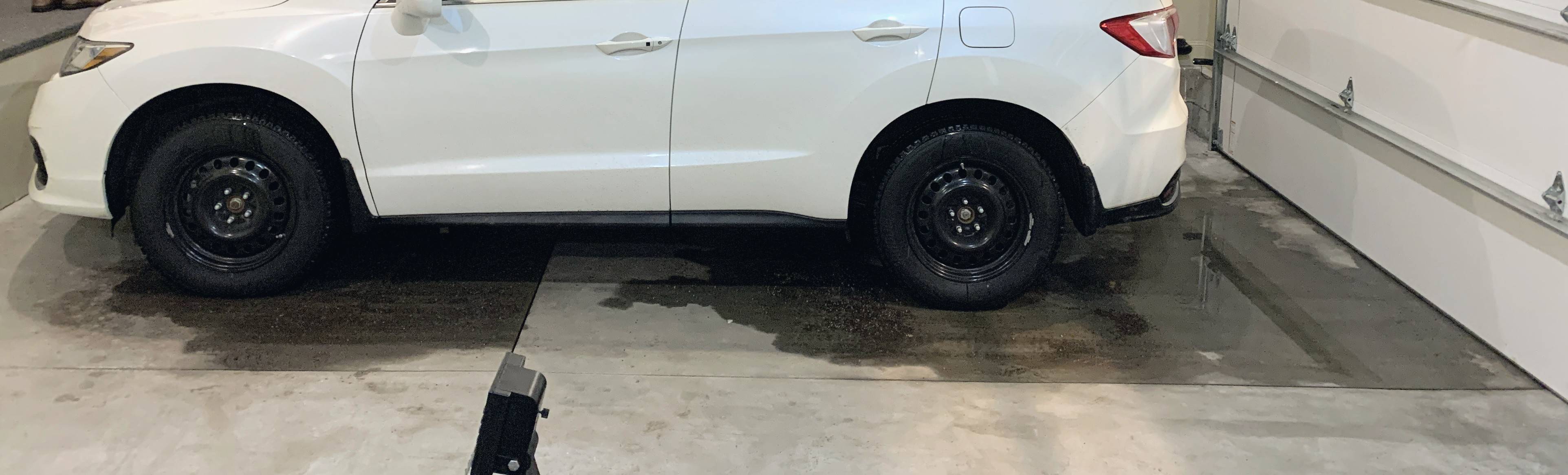 Puddles on concrete garage slab