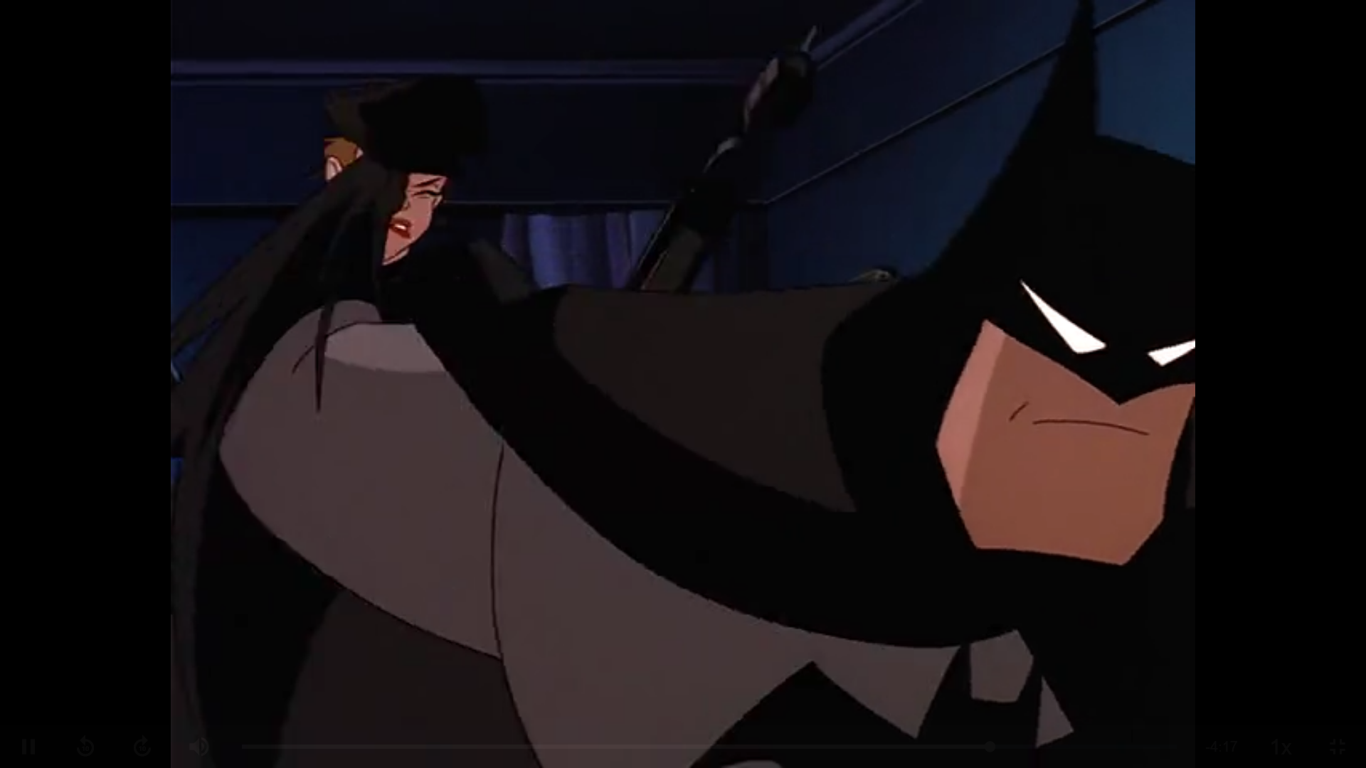 As Batman is interrogating Lex Luthor, he performs a offhand backhand punch to knock unconscious Mercy Graves who tried to shoot him from behind.