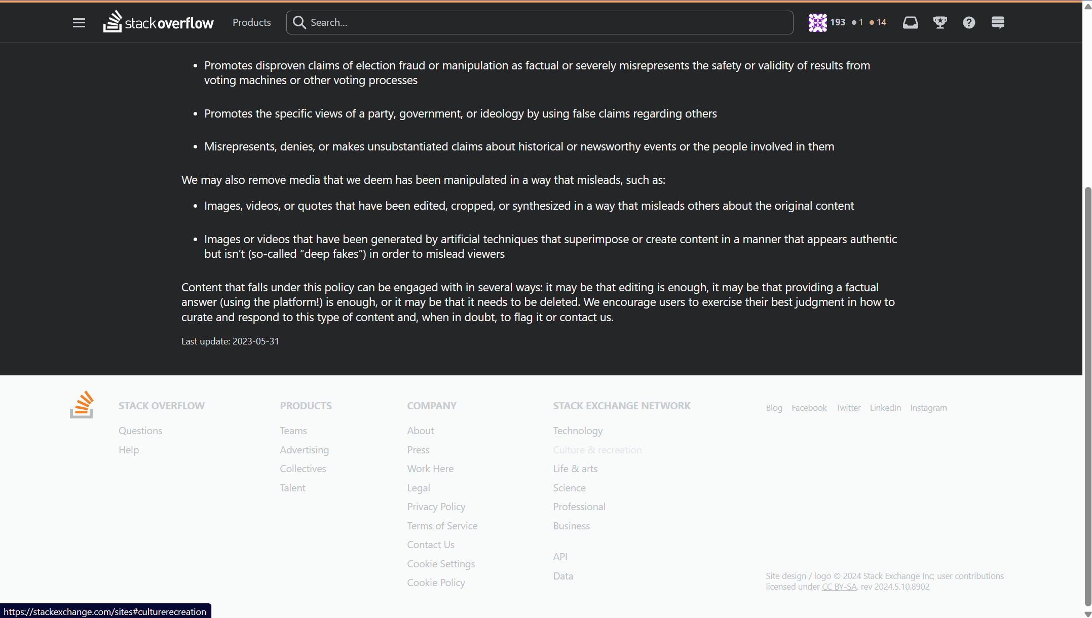 Footer of Misleading information policy page using the dark theme, but showing the footer with a light background and light, hard-to-read text