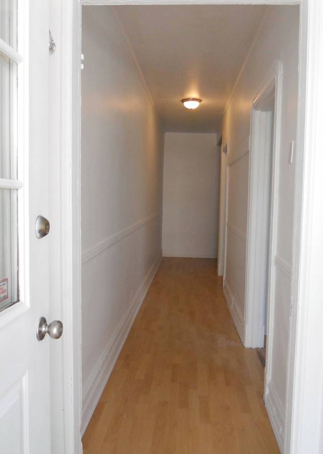 Hallway with door for each of the 'two' rooms