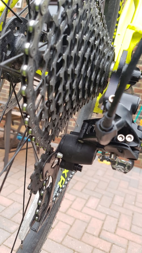 Rear derailleur with spacer