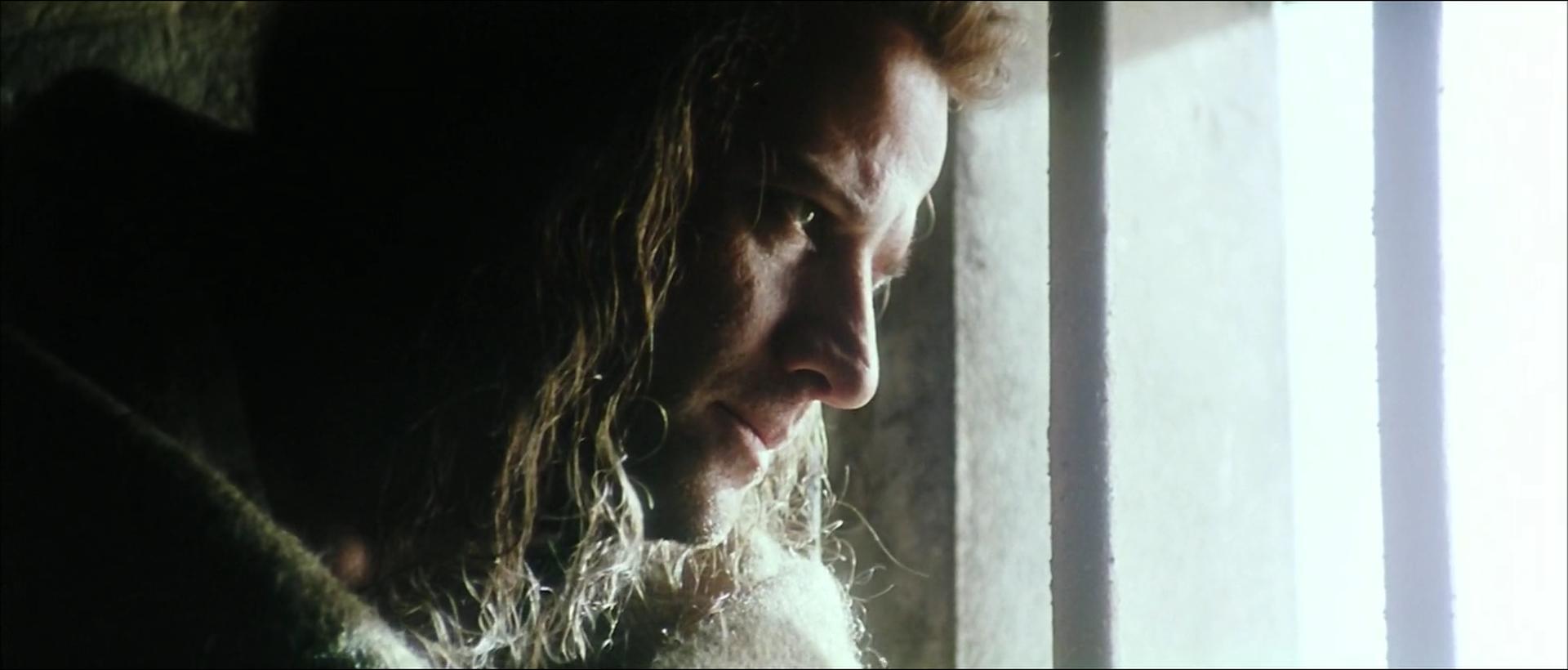 Image of Connor MacLeod in a prison cell, looking out through a window, from "Highlander III: The Sorcerer" (1994).