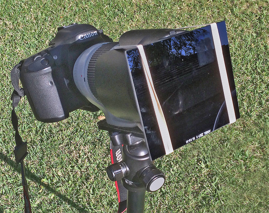 Welder's glass mounted on a Canon 70-200mm lens