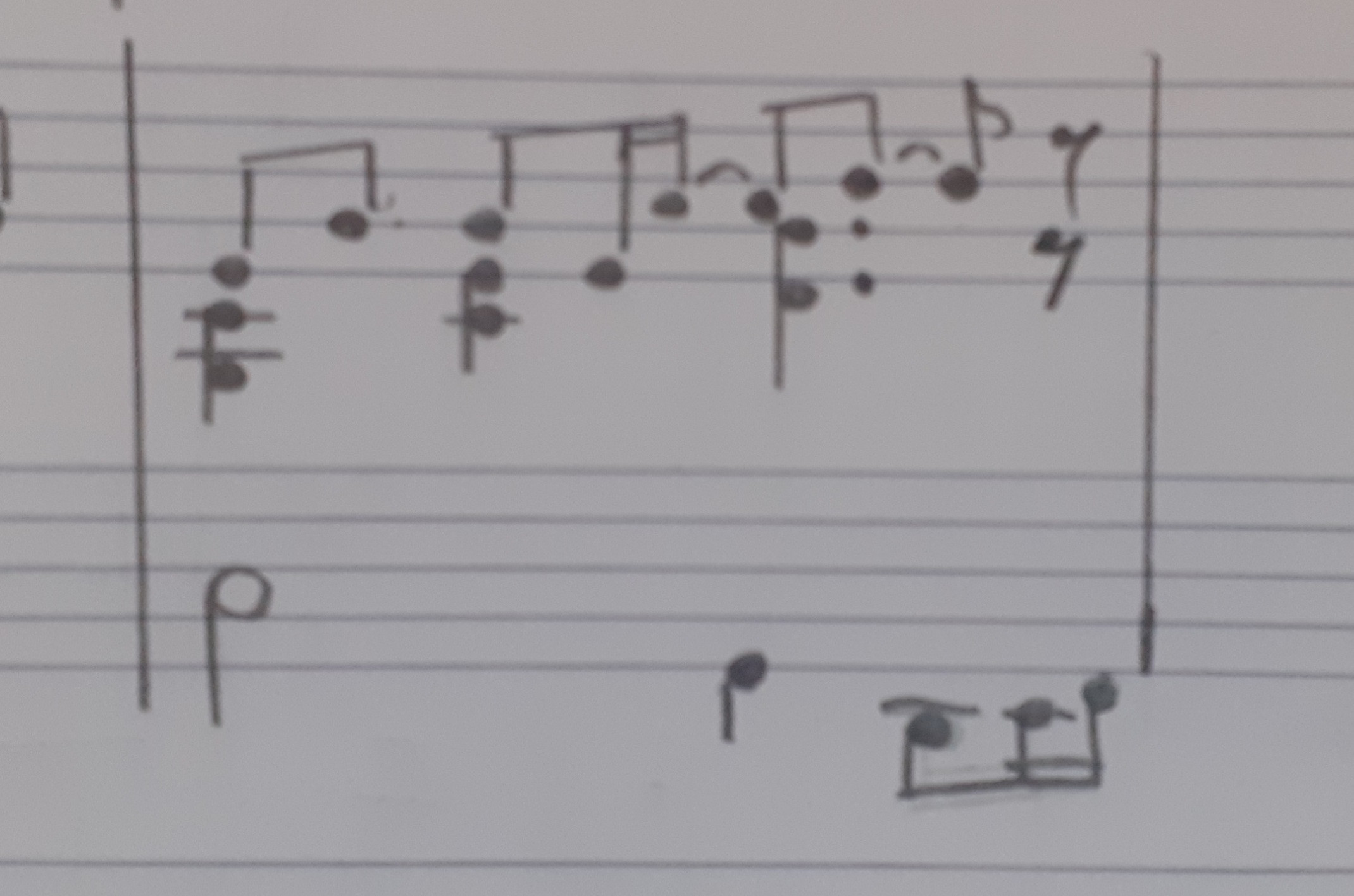 Music excerpt: The (soprano) melody is one voice the upper staff. The alto and tenor share another voice in the upper staff. The bass voice is alone in the lower staff. Both voices in the upper staff have a eighth rest at the end of the measure.