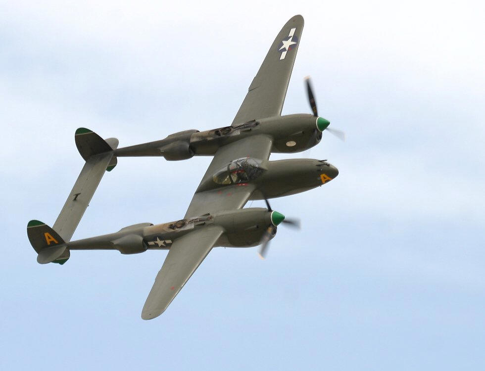 A Lockheed P-38 Lightning, with two propeller engines and a twin boom tail.