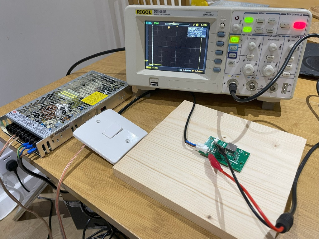 Test setup showing an oscilloscope, power supply and the device under test