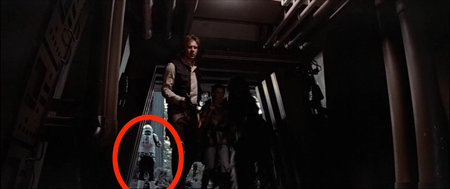 Rebels entering the bunker with Scout Trooper in the background.