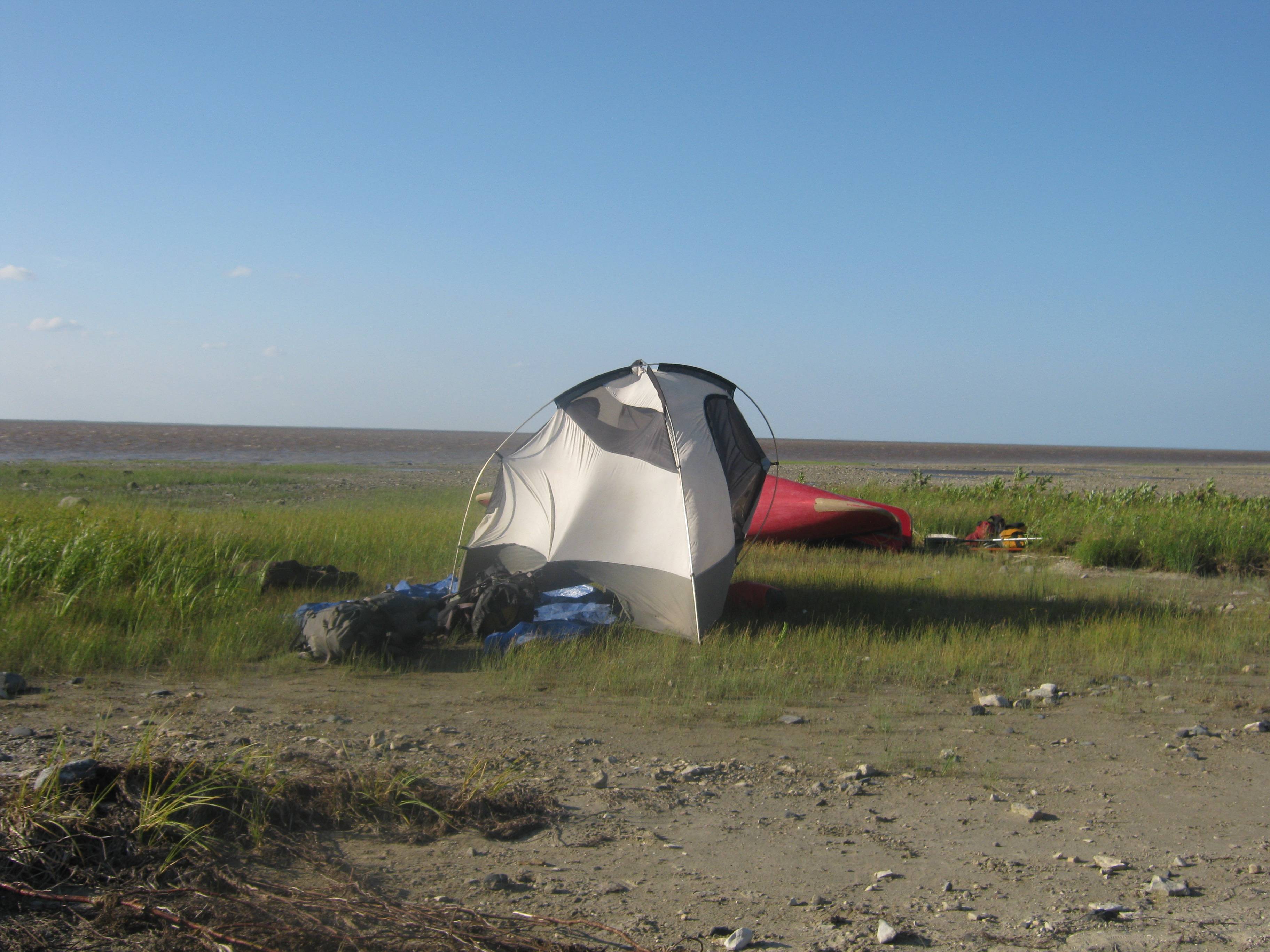 Tent tethered to packs to keep it from blowing away.