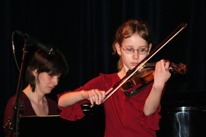 performer on black stage