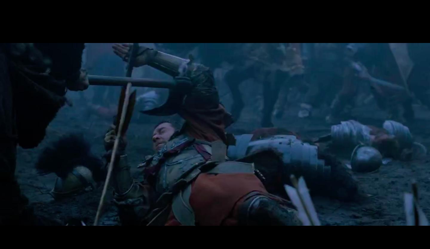 Maximus blocking the axe swing by placing the sharp edge of his gladius on his palm