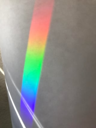 This is a photo of sun light through a diffraction grating.