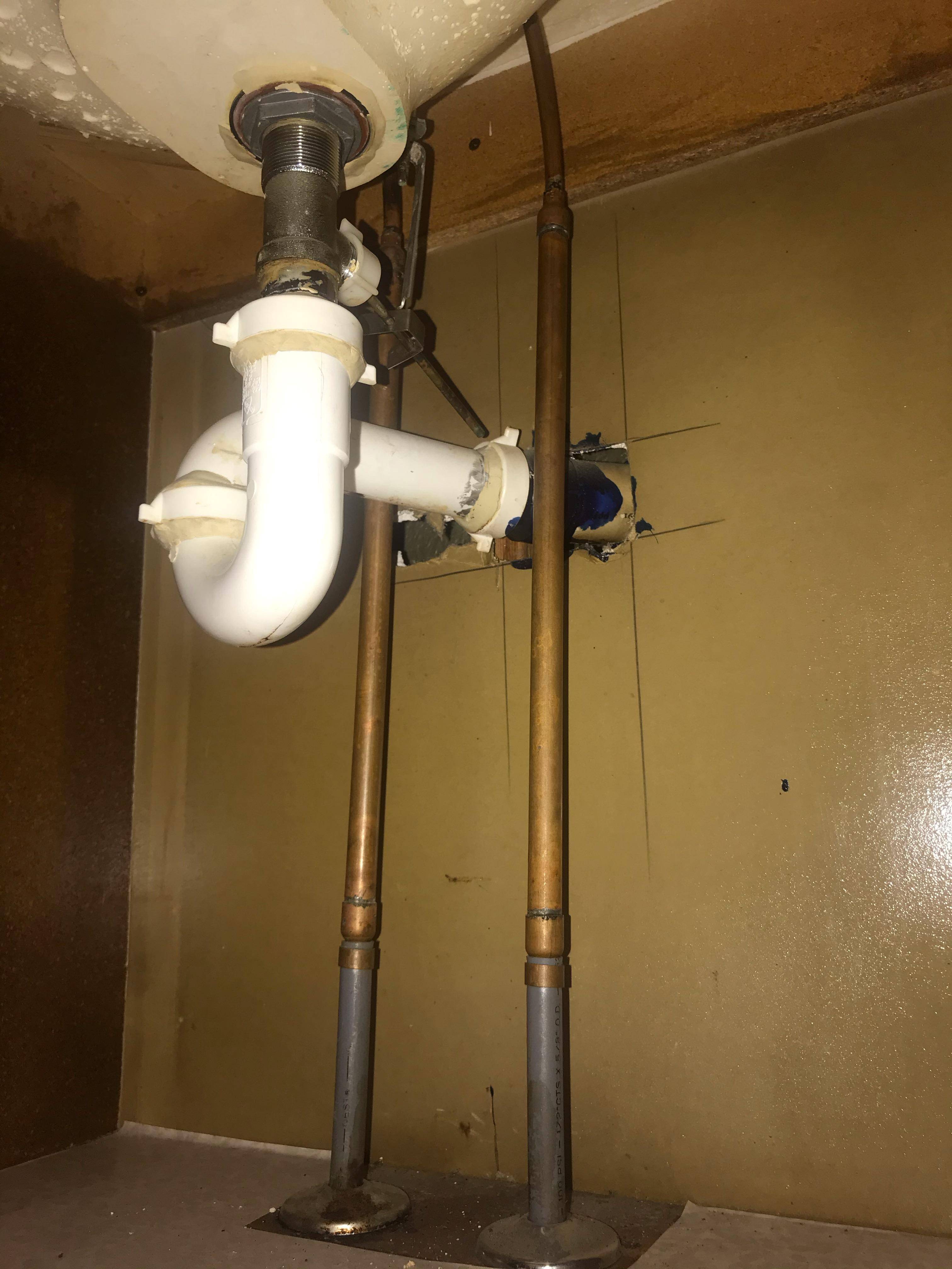 plumbing under vanity sink