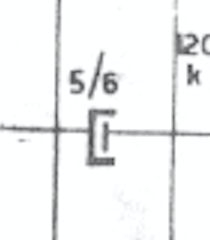 Capacitor with the broad terminal partially clamping the short one; unit "5/6"