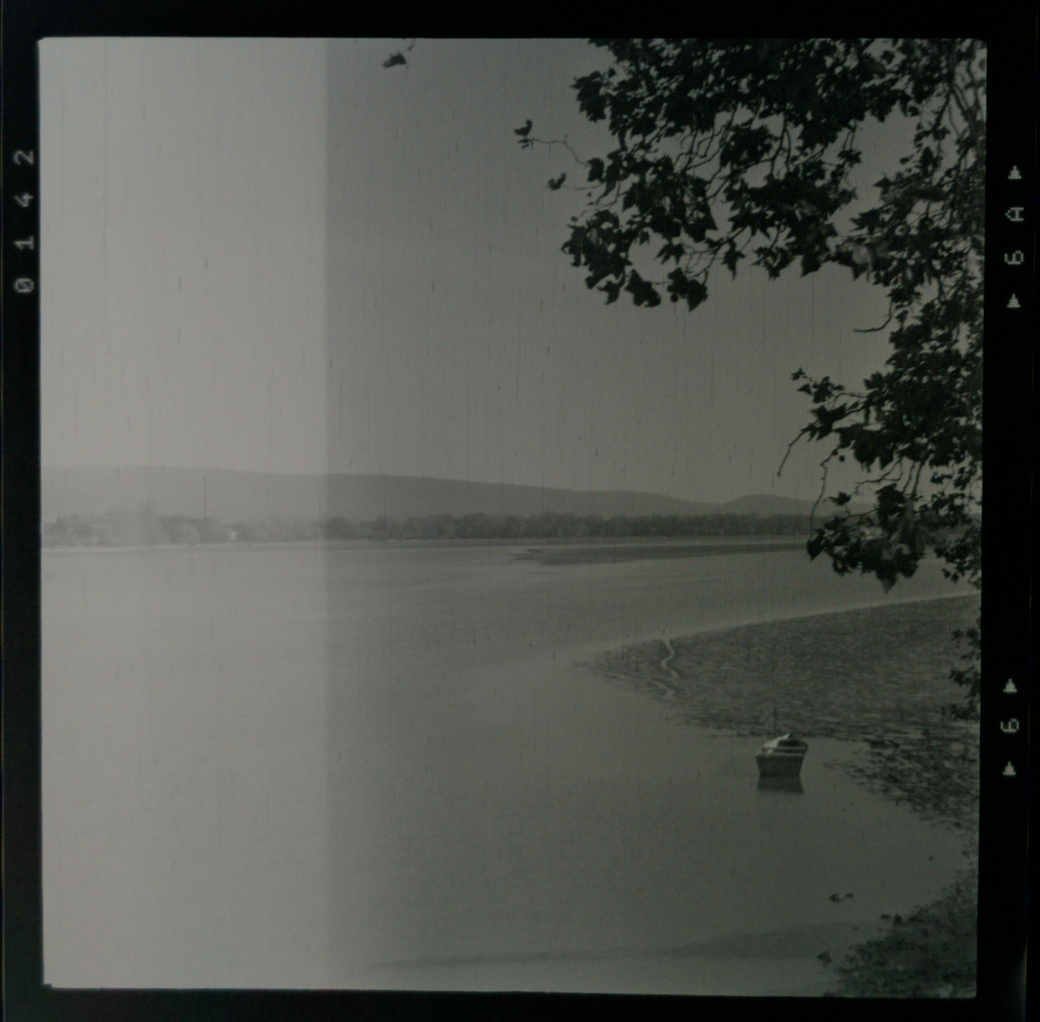 a photo of a lake in Hungary, with one side being considerably darker