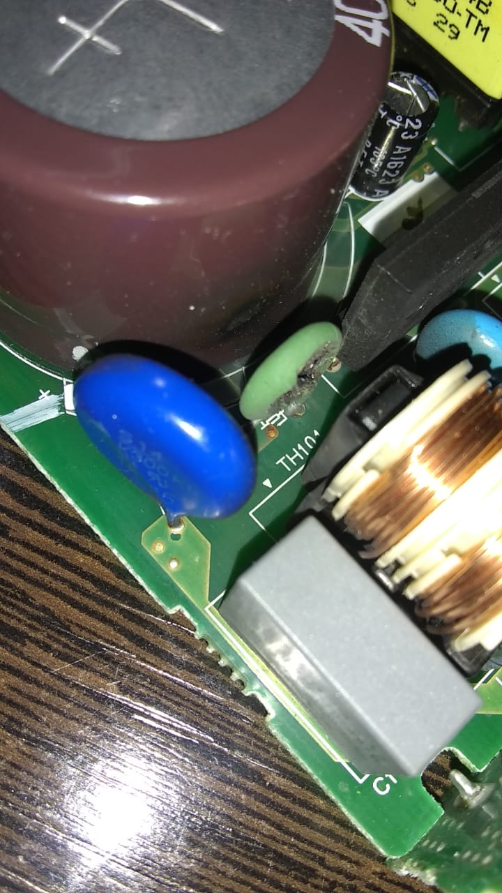 This component is on the input side of the power supply just past the bridge rectifier