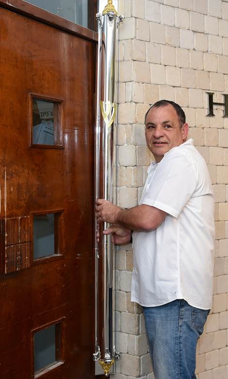 The mezuzah -- taller than the door.