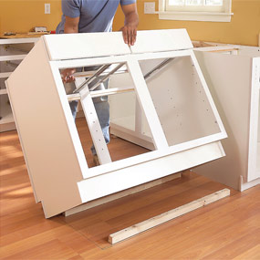 source: Step #6, photo #11 of Installing Kitchen Cabinets